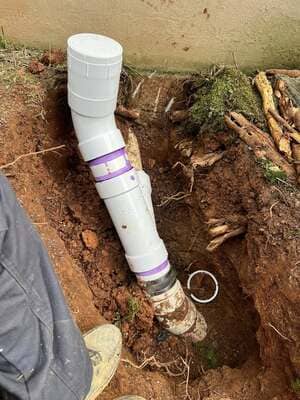 White PVC sewer pipe installed underground