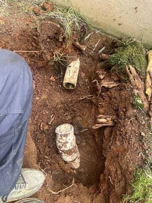 Old sewer pipes being replaced in ground